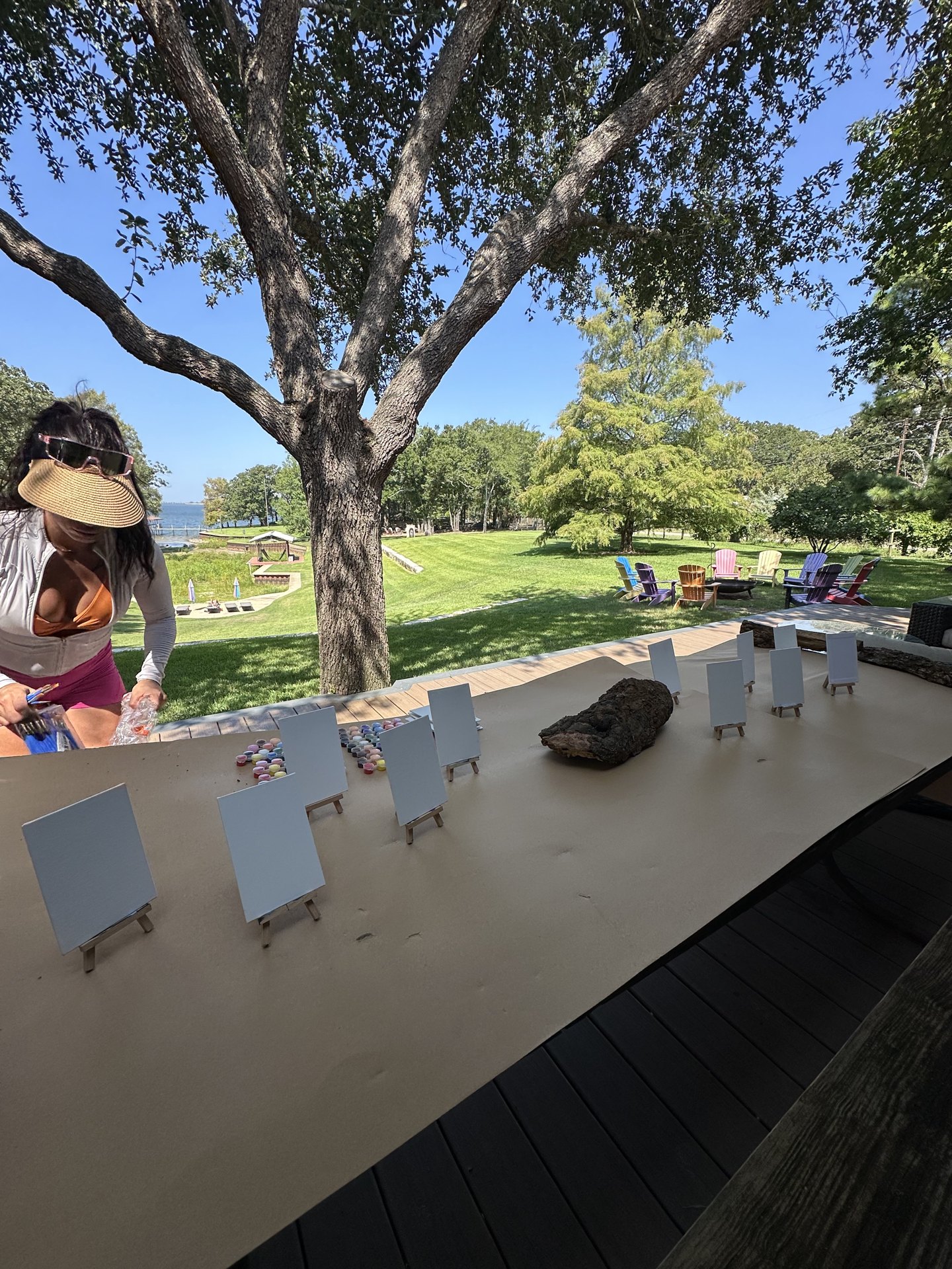 Blank canvases lined up on a lakeside table ready for a paint session